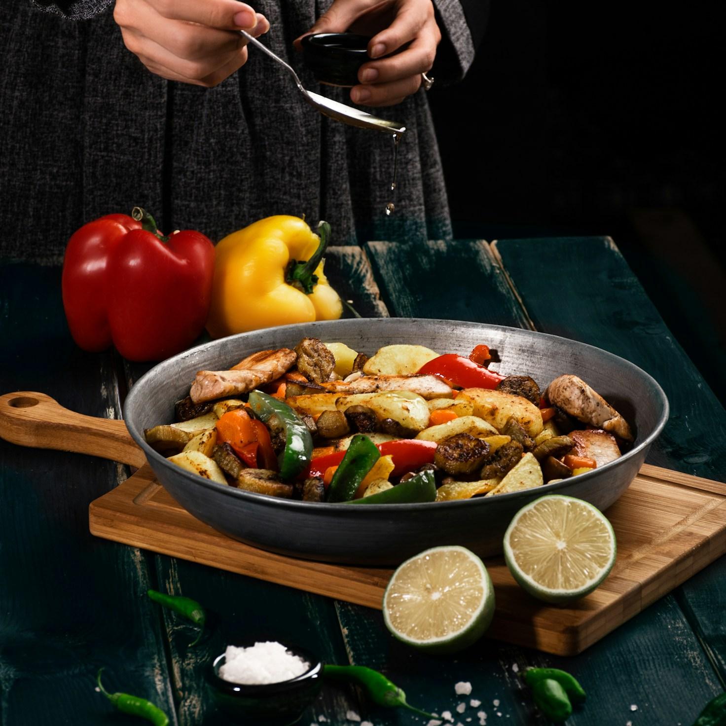 Diverse group of community members sharing a meal together, illustrating the bonds formed through collaborative cooking